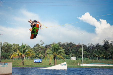 Phuket, Thailand - 10 January 2018 : man making some spin trick while playing wake board at Phuket wake parkのeditorial素材