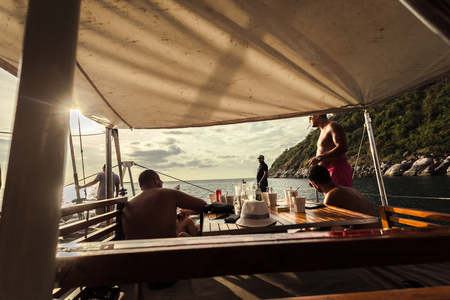 Phuket, Thailand - 17 January 2018: luxury boat party with many foreign people under sunsetのeditorial素材