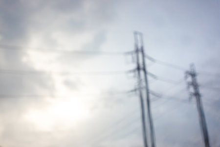 Blur electrical pole with soft blue sky and soft sun light after rainingの写真素材