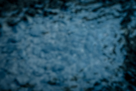 blurred of stone under river with reflection, in dramatic horror toneの写真素材