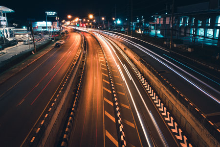 Phuket - Thailand, 21 November 2019 : Road traffic at night on the Tunnel road between shopping mall at Central festival. Long exposure cars lightのeditorial素材