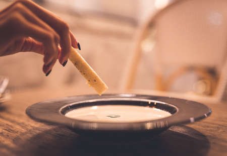 Mushroom soup with bread to dip in cafeの写真素材
