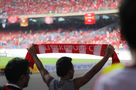 KUALA LUMPUR - JULY 16 : Supporters cheer during the football game of Malaysia vs Liverpool Asian Tour 2011 at Bukit Jalil National Stadium on July 16, 2011 in Kuala Lumpur, Malaysia.のeditorial素材