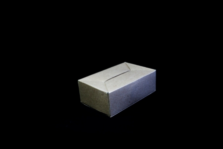 Cardboard Box Isolated on Black Backgroundの写真素材