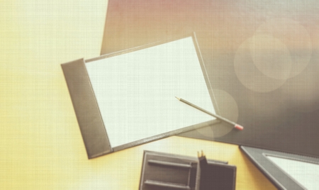 Office desk table with pencil and blank paper. Slightly defocused. Top view with copy spaceの写真素材