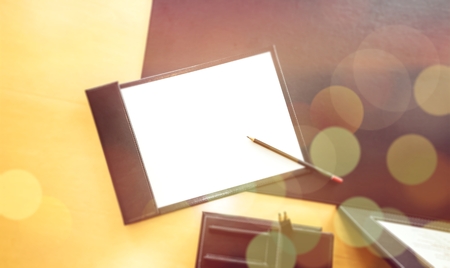 Office desk table with pencil and blank paper. Slightly defocused. Top view with copy spaceの写真素材