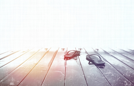 Flip flops on wooden deck with summer background. Copy spaceの写真素材
