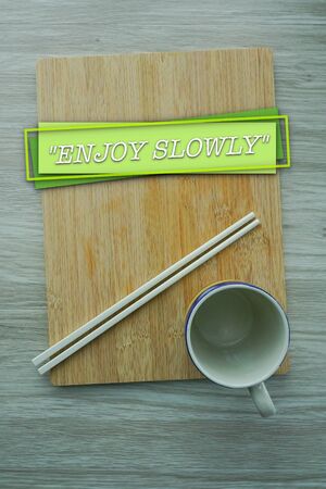 Diet and healthy lifestyle concept with word ENJOY SLOWLYの写真素材