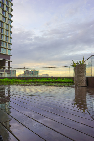 Sunrise with a wooden deck in the foreground. There is copy space in the image.の写真素材