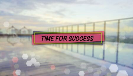 Word TIME FOR SUCCESS on blurred background of sunrise over an infinity swimming poolの写真素材