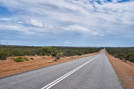 Wind turbines against a blue skyの写真素材