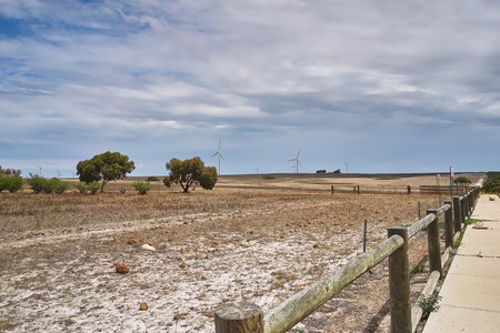 Wind turbines against a blue skyの写真素材