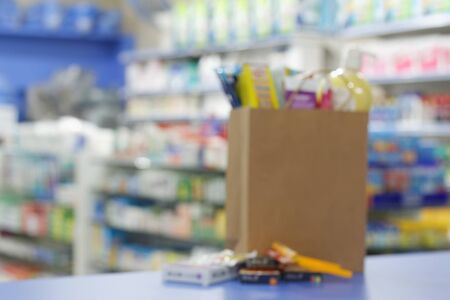 Blurred image of shopping bag on the counter in the shop.の写真素材