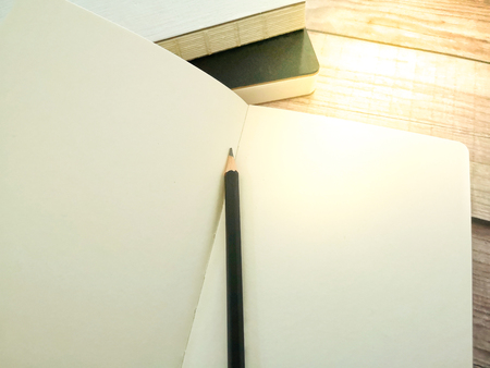 Stack of book, an open book and a pencil. Concept of learning, knowledge and education. Copy space.の写真素材