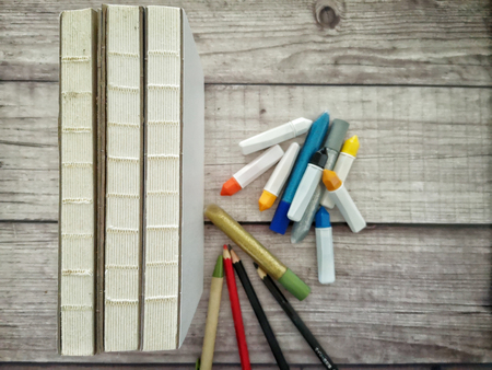 Stack of books and art or office suppliesの写真素材