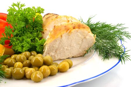 chicken with raw vegetables and greensの写真素材