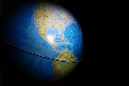 terrestrial globe in the darkの写真素材