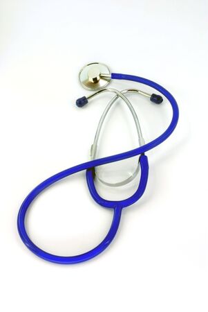 blue medicine stethoscope against white backgroundの写真素材