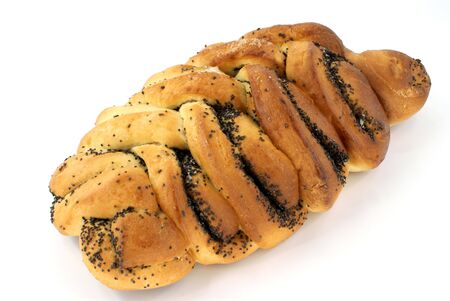 home-made bun with poppy-seed against white backgroundの写真素材