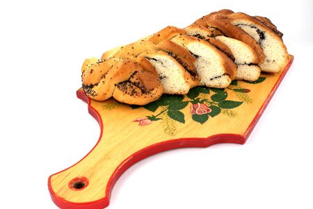 home-made bun with poppy-seed on wooden plantの写真素材