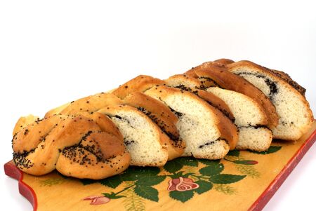 home-made bun with poppy-seed on wooden plantの写真素材