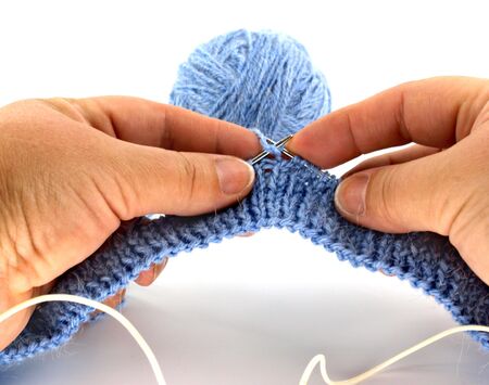 skein of blue thread with knitted itemの写真素材