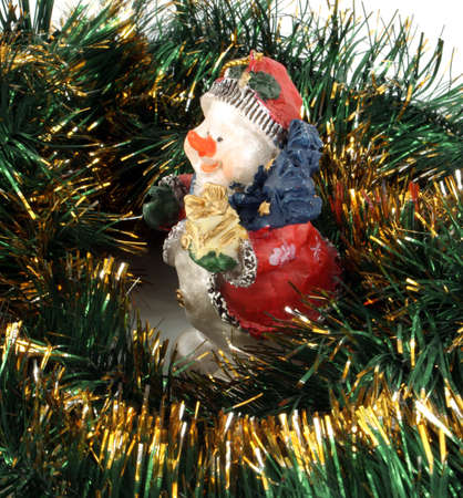 Christmas handmade toy snowman with bright tinsel の写真素材