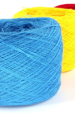 three bobbin of thread against white background