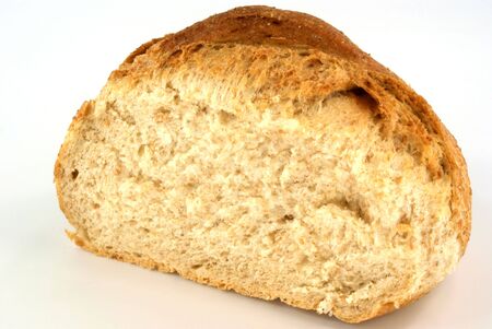 cut loaf of bread against white background