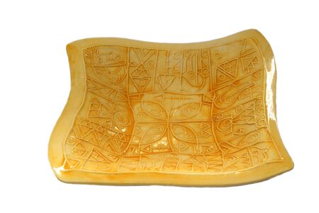 ceramic plate in African style against white backgroundの写真素材