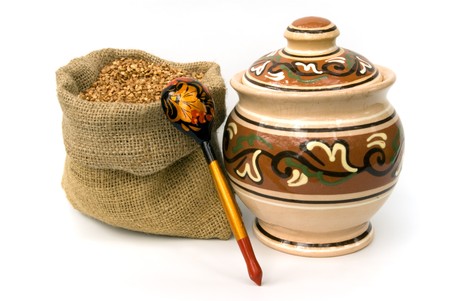 bag with buckwheat and wooden spoon and ceramic potの写真素材