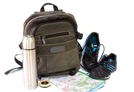  knapsack with sneakers against white backgroundの写真素材