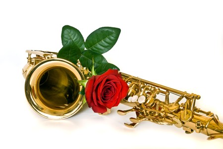 alto sax with rose against white backgroundの写真素材
