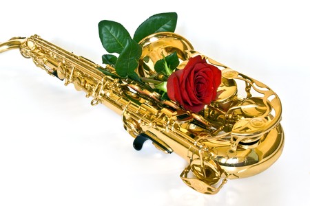 alto sax with rose against white backgroundの写真素材