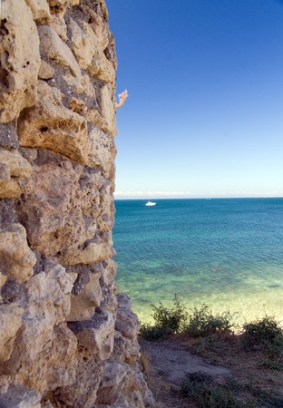 ruins of ancient castle against seaの写真素材