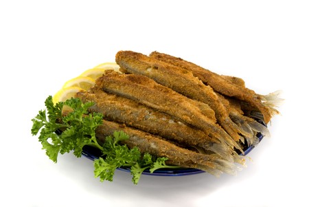 fried small fish on the plate