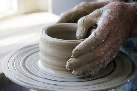 the creation of pottery on wheelの写真素材