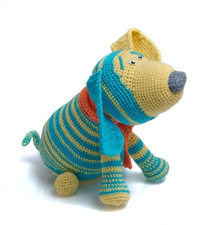 toy as knitted dog on white backgroundの写真素材