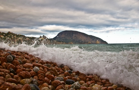 pebble and wave in coastの写真素材