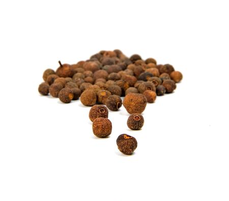 seeds of allspice on white backgroundの写真素材