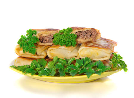 pancakes with meat on plate on white background
