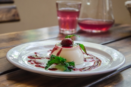 panna-cotta with berry on plate in restaurantの写真素材