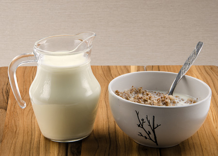 buckwheat porridge with milk in a ceramic bowl