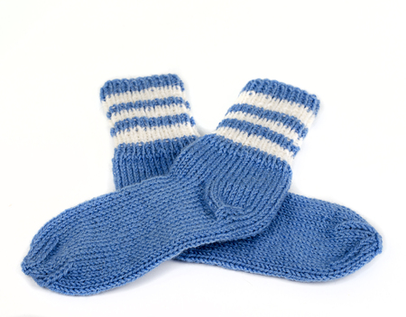 knitted socks from woolen thread and on white backgroundの写真素材