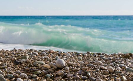 Sea and pebble beach on a sunny dayの写真素材