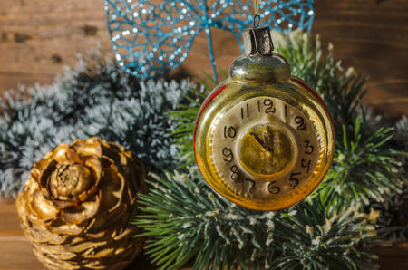 Retro clock with old fashioned christmas tree decorationsの写真素材