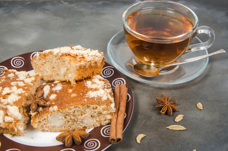 tea and biscuit on plate on dark backgroundの写真素材