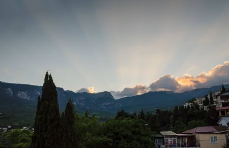 evening mountain and sunny ray at sunset