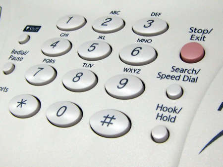 A close up of the control panel of a company fax machine