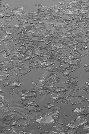 Closeup of ice floe in Vantaanjoki river in winter, Vantaa, Finland.